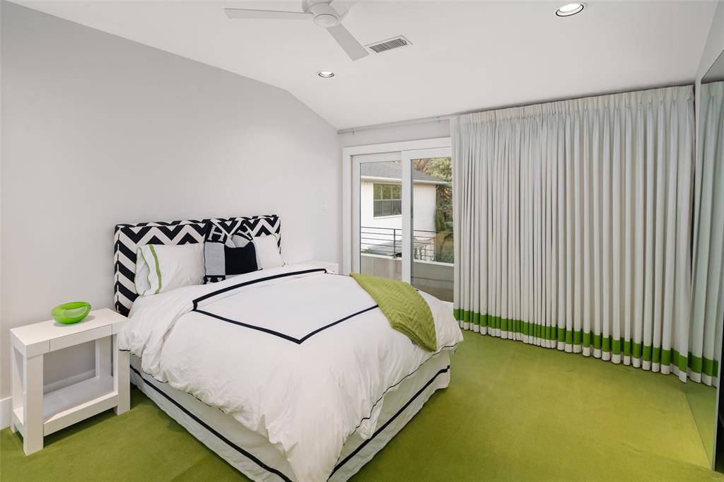 5811 Meletio Lane Dallas, TX 75230 - Photo 24 of 31 a bedroom with a bed and a window