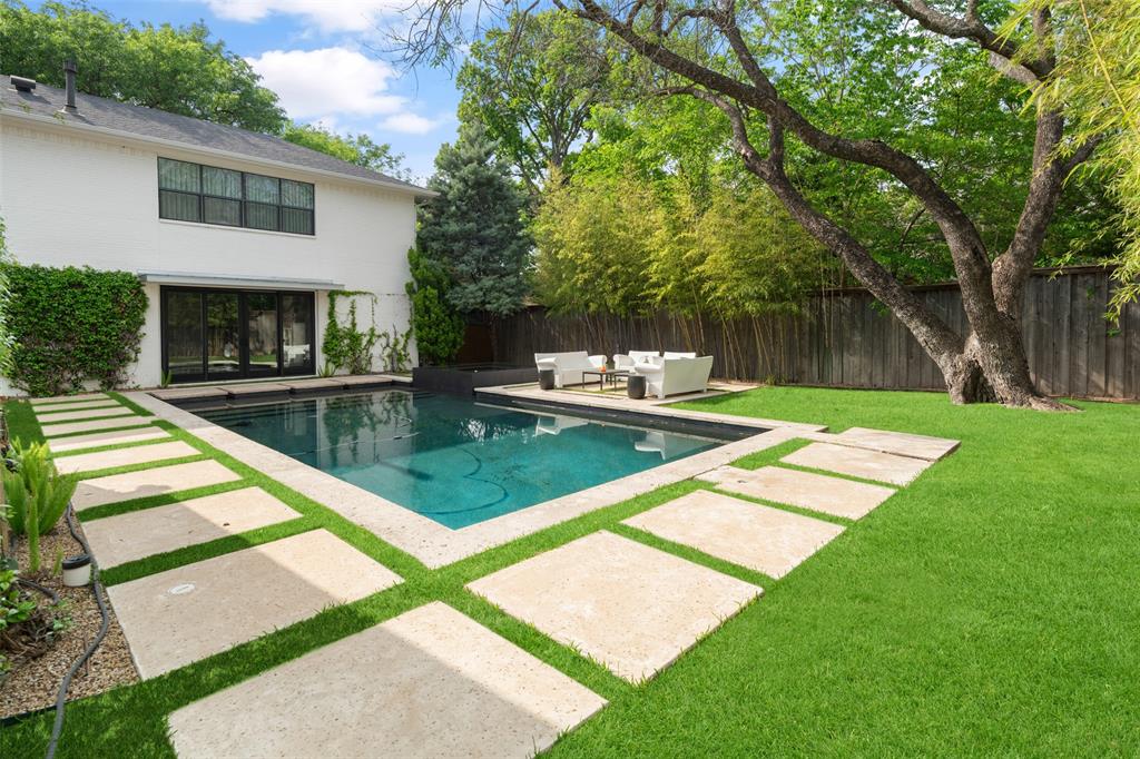 5811 Meletio Lane Dallas, TX 75230 - Photo 26 of 31 a view of a backyard with a patio