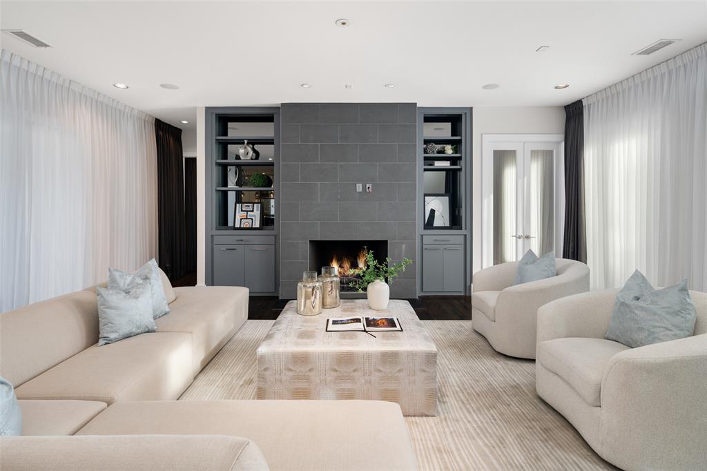 5811 Meletio Lane Dallas, TX 75230 - Photo 6 of 31 a living room with furniture and a fireplace