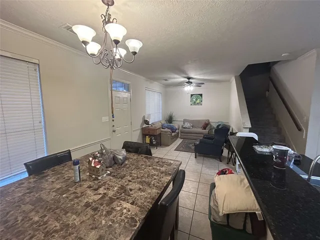 a very nice looking dining room with a table and chairs