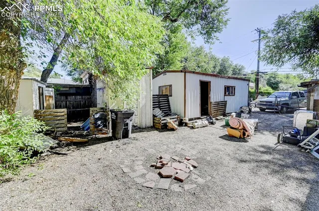 a view of a backyard with a sitting area and furniture