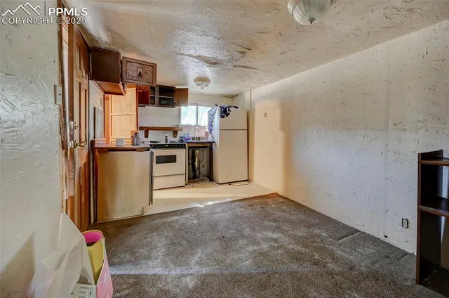 a view of a kitchen with a sink