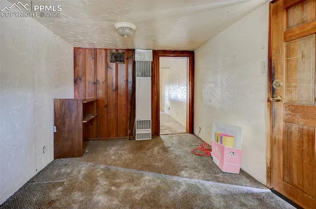 a view of an empty room with windows