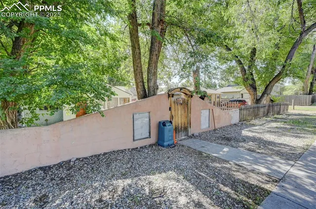 a view of a house with a tree