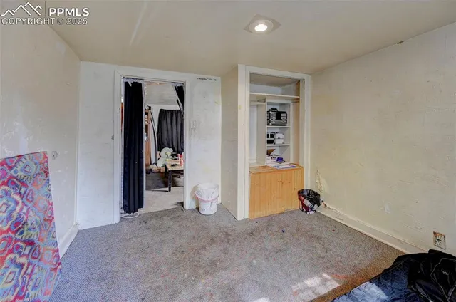 a view of a livingroom and a hallway