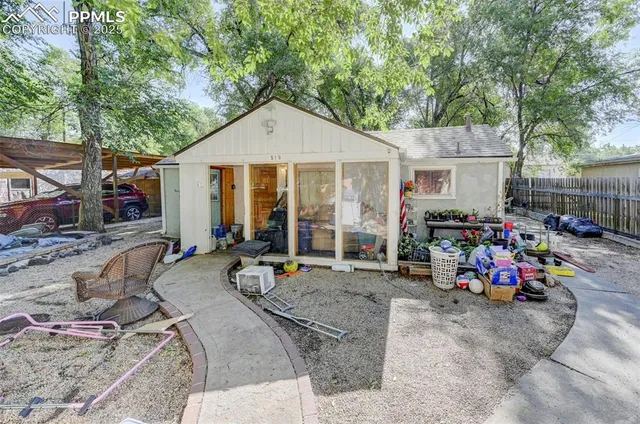 a view of a car park in front of house