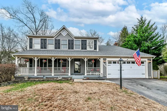 a house with trees in the background