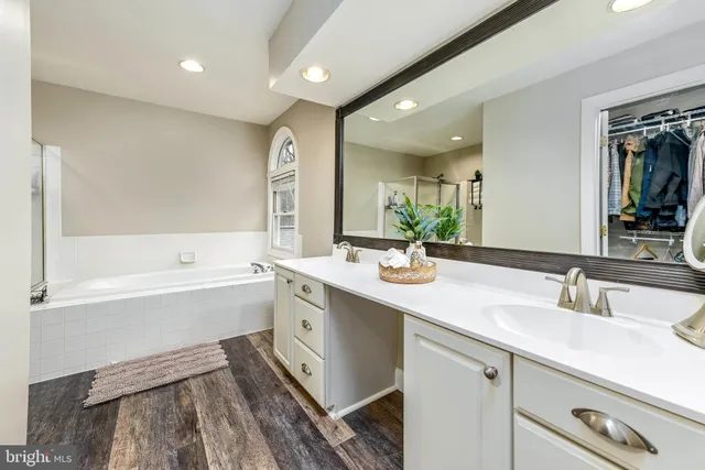 a bathroom with a bathtub and a shower