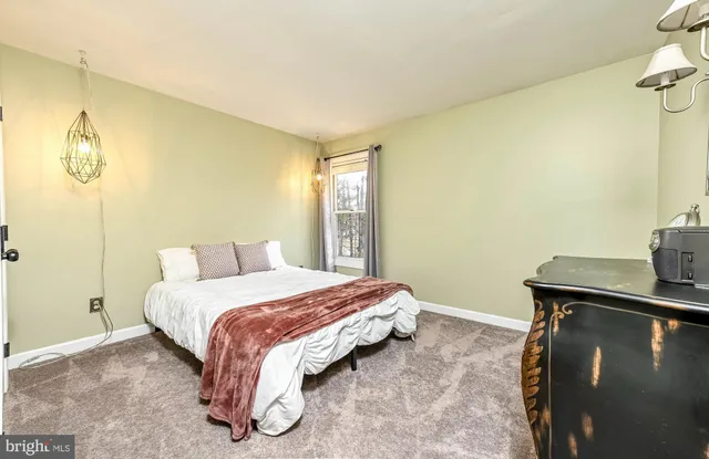 a bathroom with a double vanity sink toilet mirror and shower