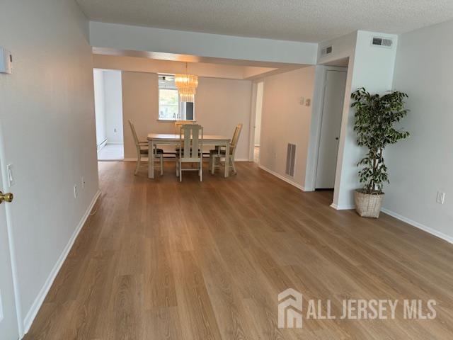 525 B Belford Road Monroe Township, NJ 08831 - Photo 3 of 8 a living room with furniture and a potted plant