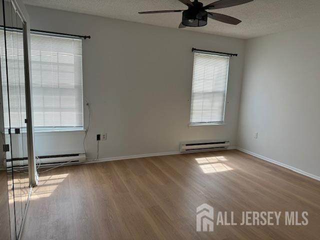 525 B Belford Road Monroe Township, NJ 08831 - Photo 5 of 8 a view of an empty room with a window