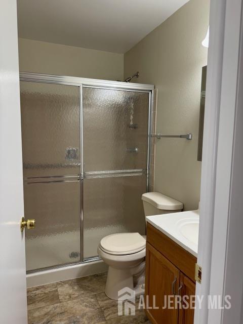 525 B Belford Road Monroe Township, NJ 08831 - Photo 8 of 8 a bathroom with a toilet and a shower