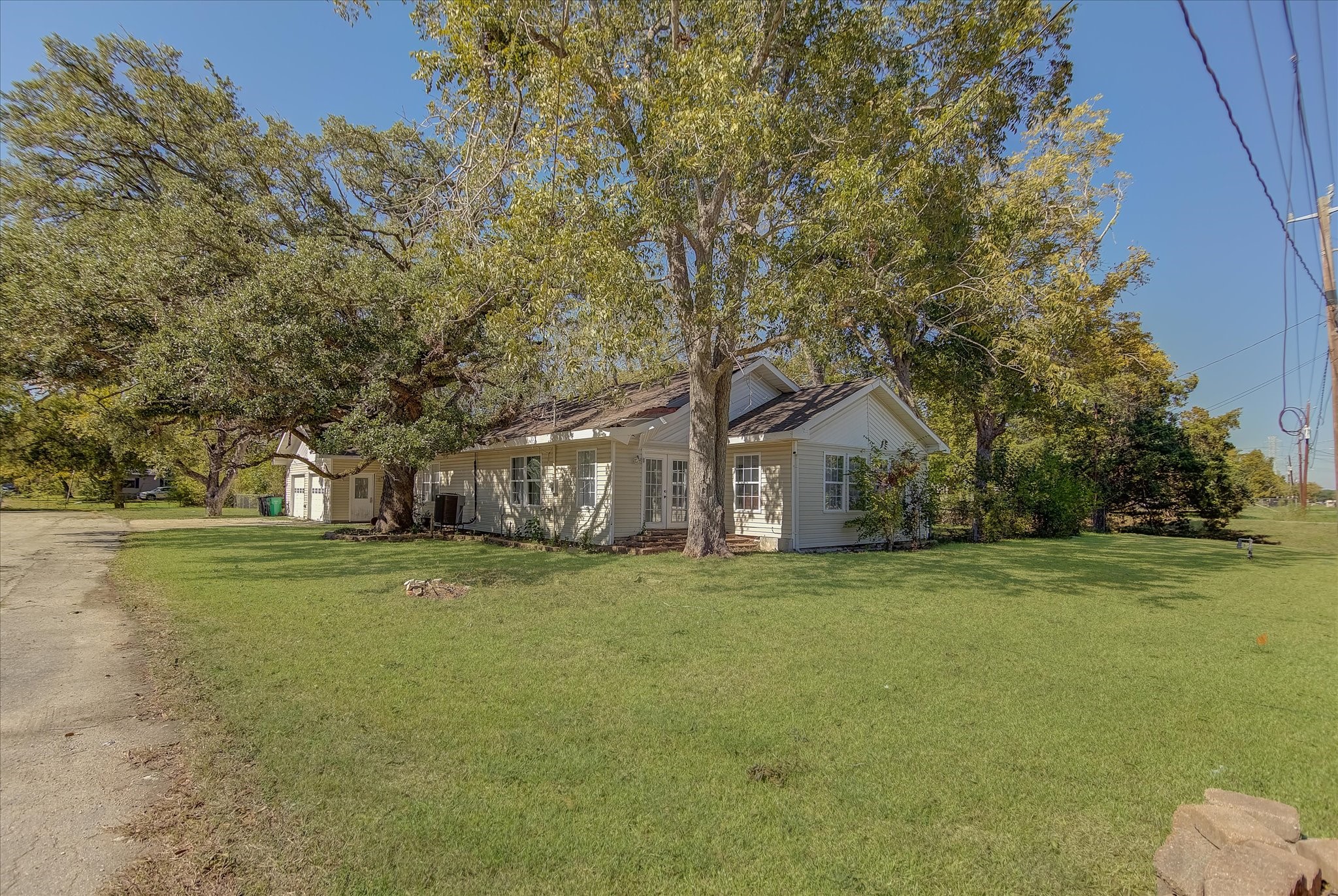 4123 Crosby Cedar Bayou Road Baytown, TX 77521 - Photo 1 of 26 a house with trees in front of it
