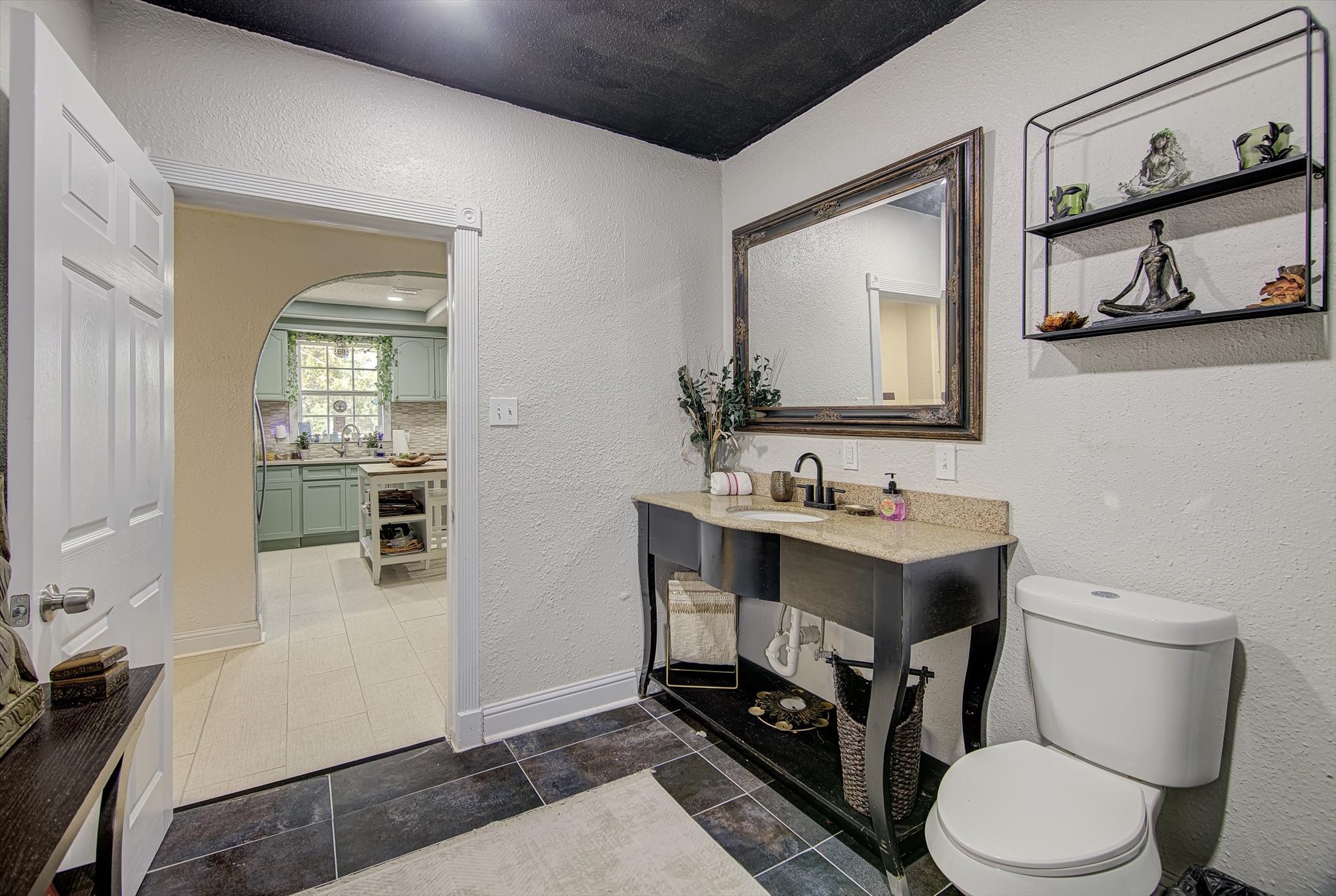 4123 Crosby Cedar Bayou Road Baytown, TX 77521 - Photo 13 of 26 a bathroom with a sink a toilet and mirror
