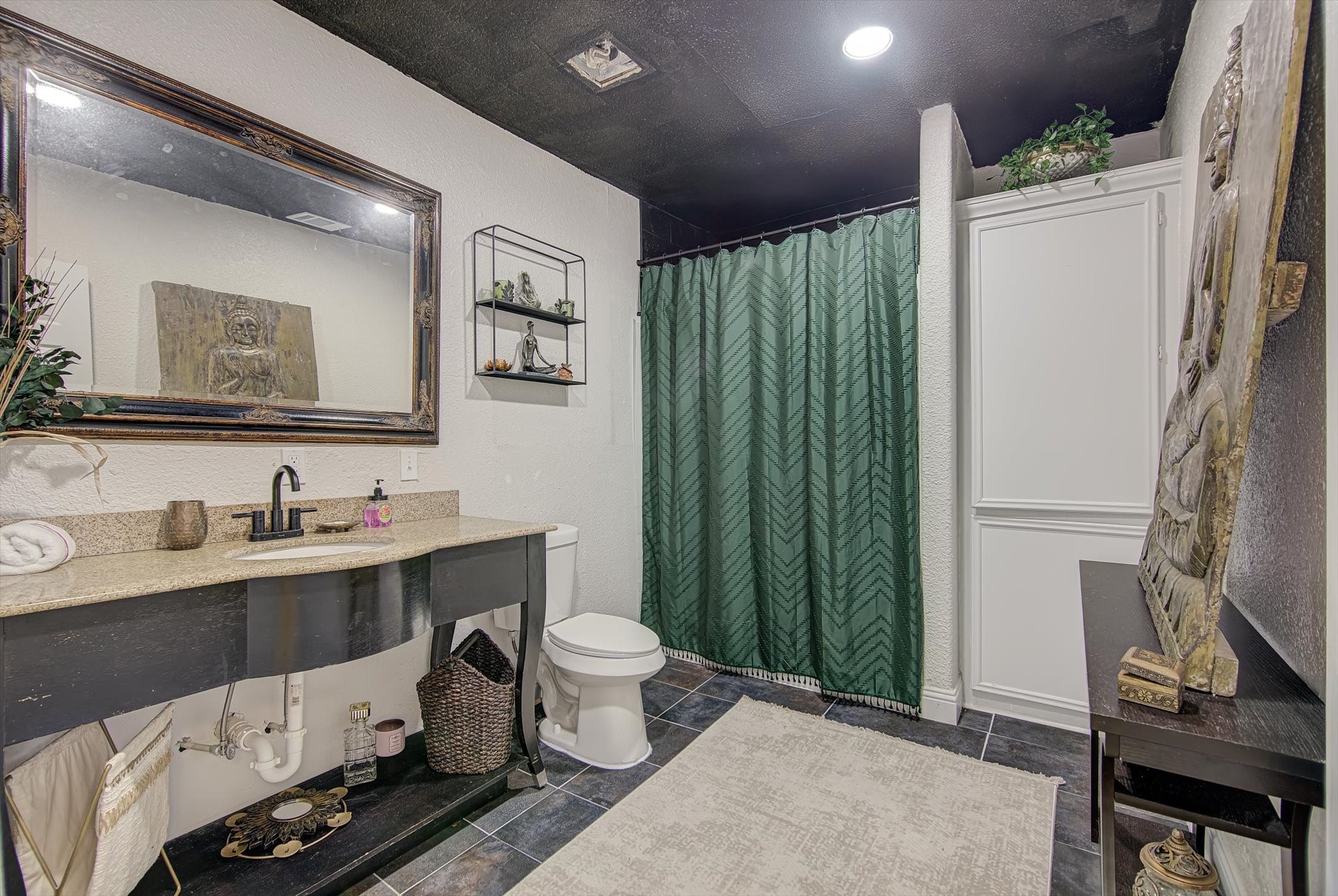 4123 Crosby Cedar Bayou Road Baytown, TX 77521 - Photo 14 of 26 a bathroom with a sink toilet and a mirror