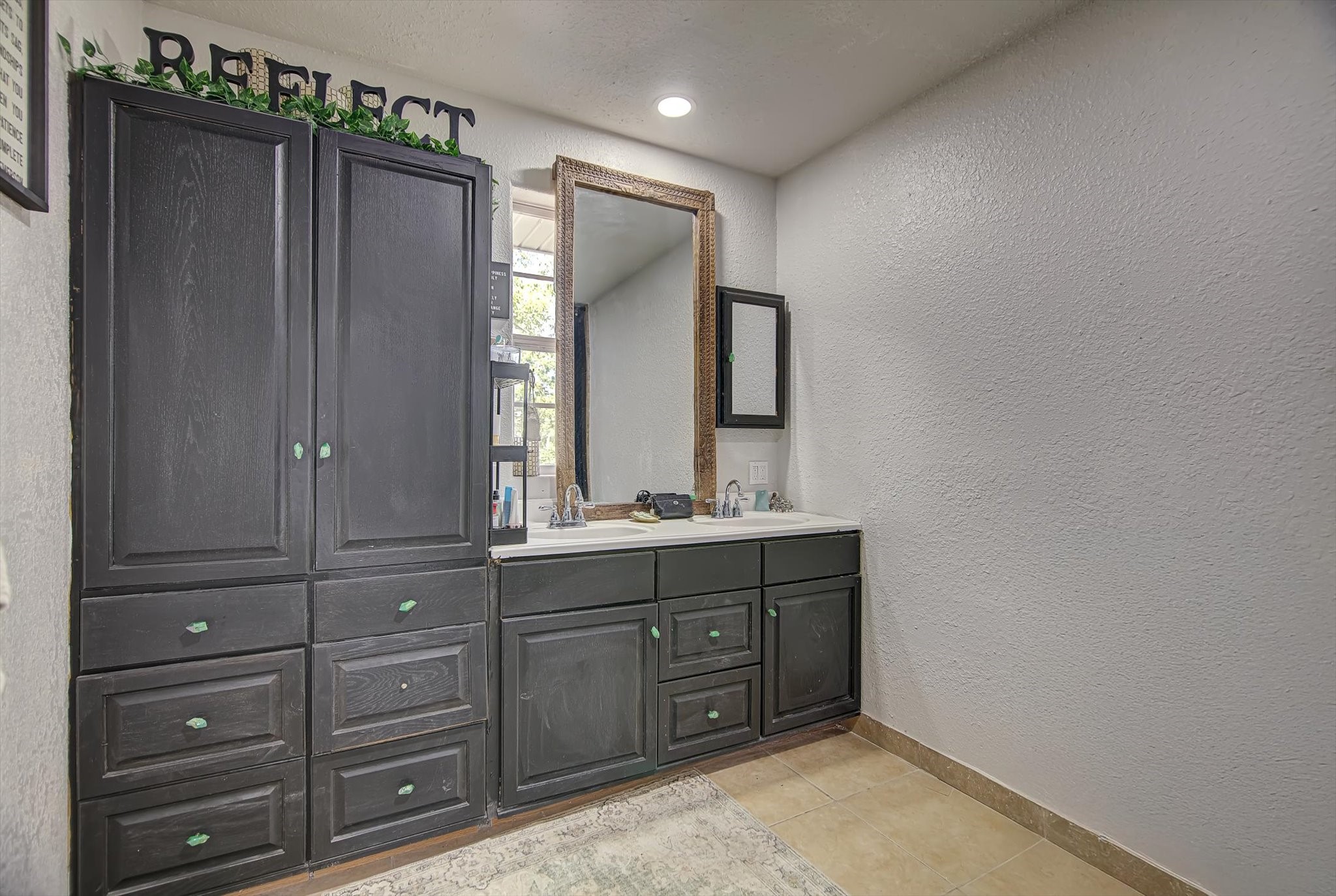 4123 Crosby Cedar Bayou Road Baytown, TX 77521 - Photo 16 of 26 a bathroom with a double vanity sink and mirror