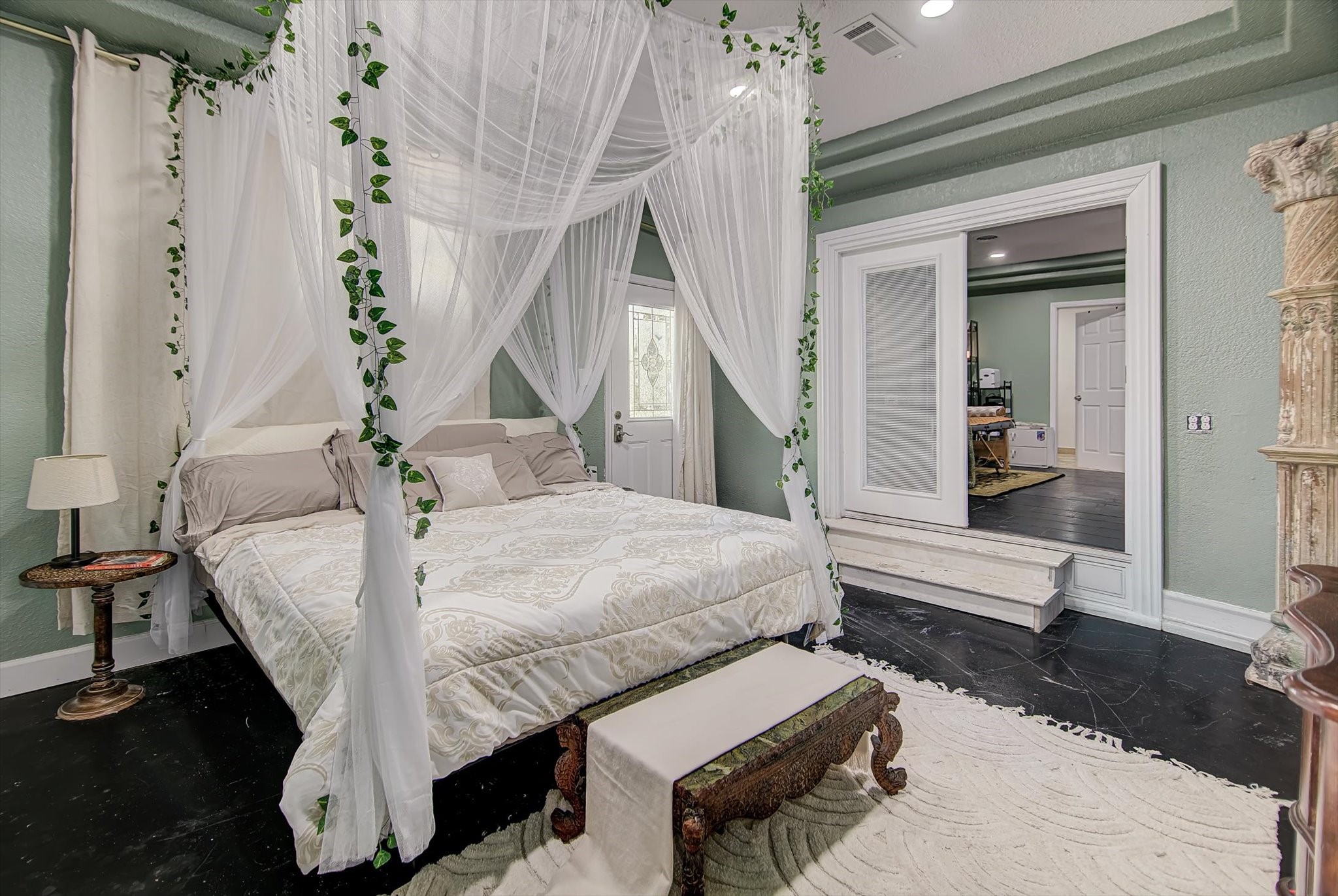 4123 Crosby Cedar Bayou Road Baytown, TX 77521 - Photo 18 of 26 a bed room with a bed and a chandelier