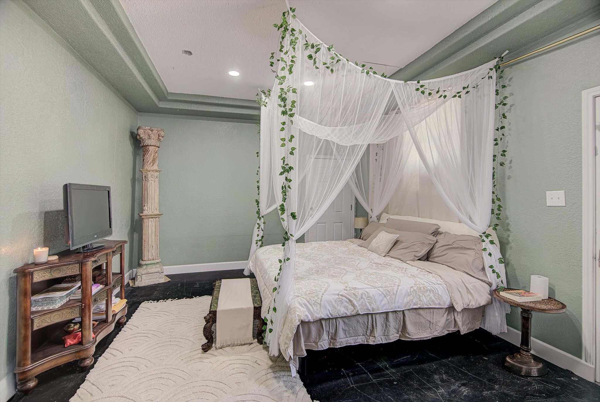 4123 Crosby Cedar Bayou Road Baytown, TX 77521 - Photo 19 of 26 a bedroom with a bed and a flat screen tv