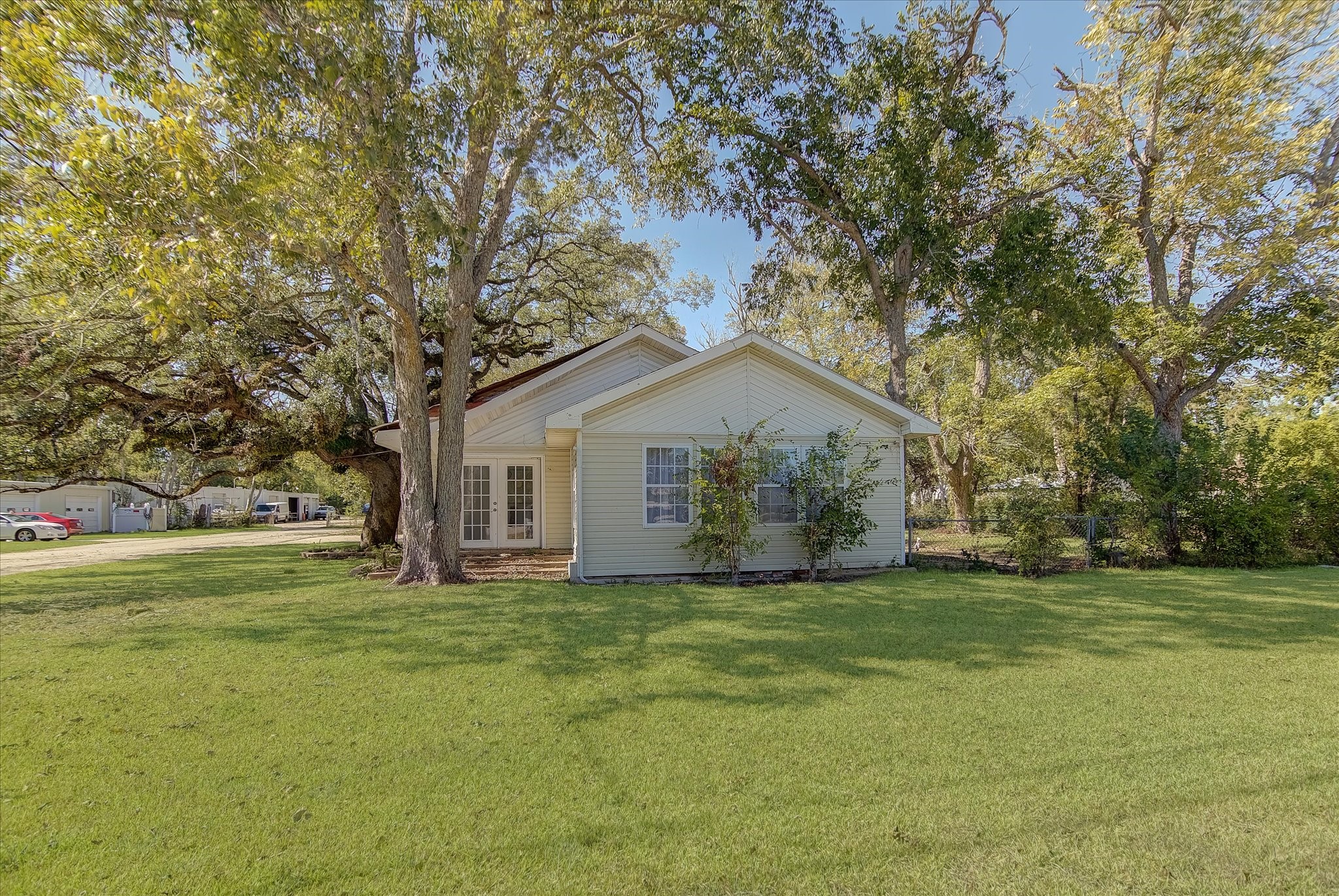 4123 Crosby Cedar Bayou Road Baytown, TX 77521 - Photo 2 of 26 a front view of house with yard and trees all around