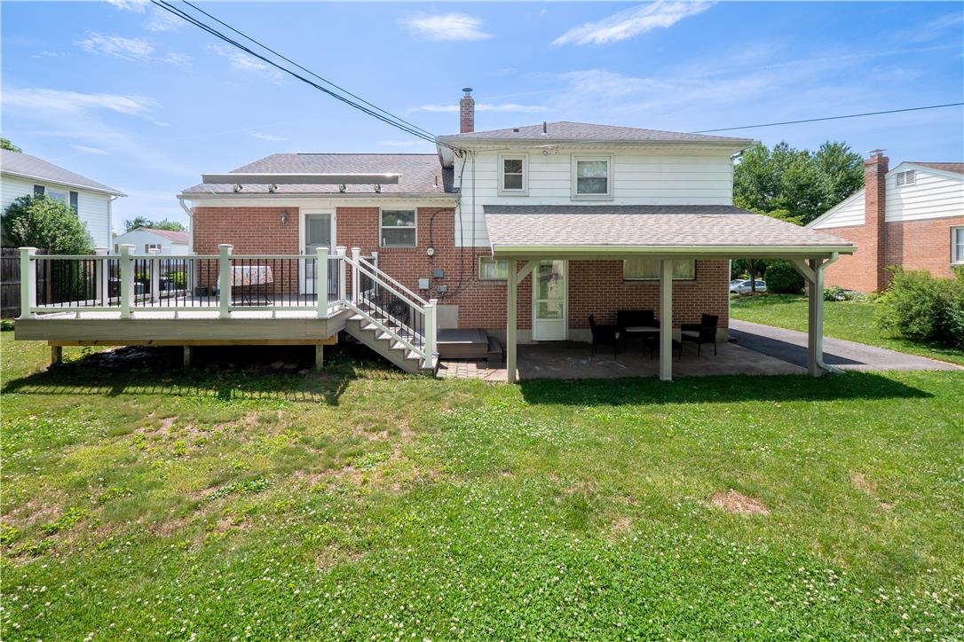 2439 Congress Street Allentown, PA 18104 - Photo 23 of 34 A backyard oasis offers a spacious deck and covered patio, perfect for outdoor enjoyment.