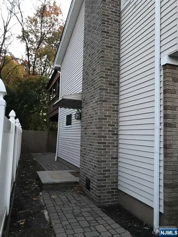 a view of a door of a house with a yard