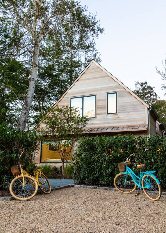 a backyard of a house with table and chairs