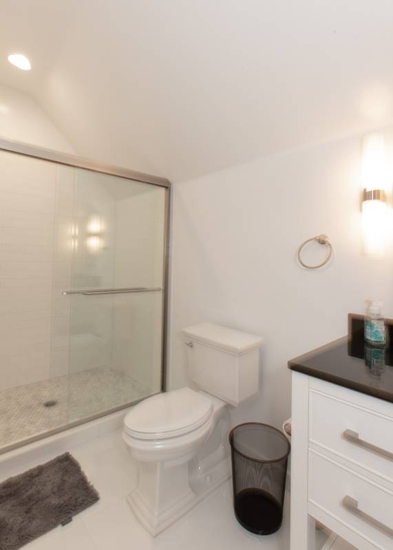 16 Roosevelt Road Montauk, NY 11954 - Photo 15 of 30 a bathroom with a toilet a sink and shower