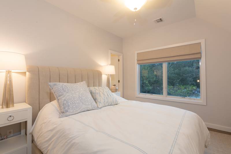 16 Roosevelt Road Montauk, NY 11954 - Photo 19 of 30 a bedroom with a large bed and a large window
