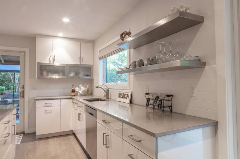 16 Roosevelt Road Montauk, NY 11954 - Photo 8 of 30 a kitchen with a sink cabinets and window