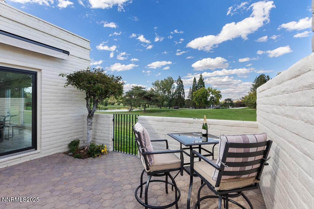 4811 Lakeridge Terrace West Reno, NV 89509 - Photo 4 of 43 a patio with table and chairs