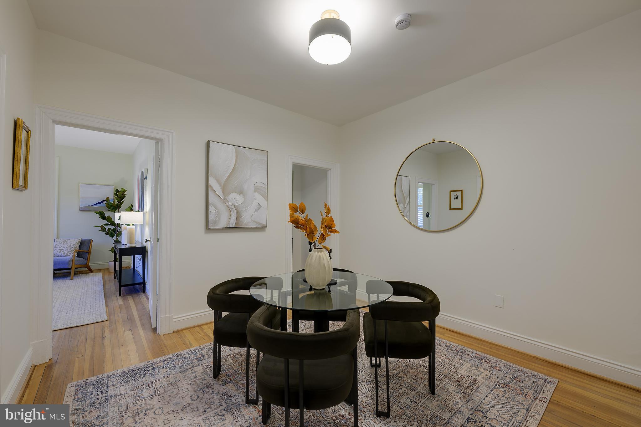 3100 Connecticut Avenue Northwest, Unit 145 Washington, DC 20008 - Photo 11 of 35 a dining room with furniture and wooden floor