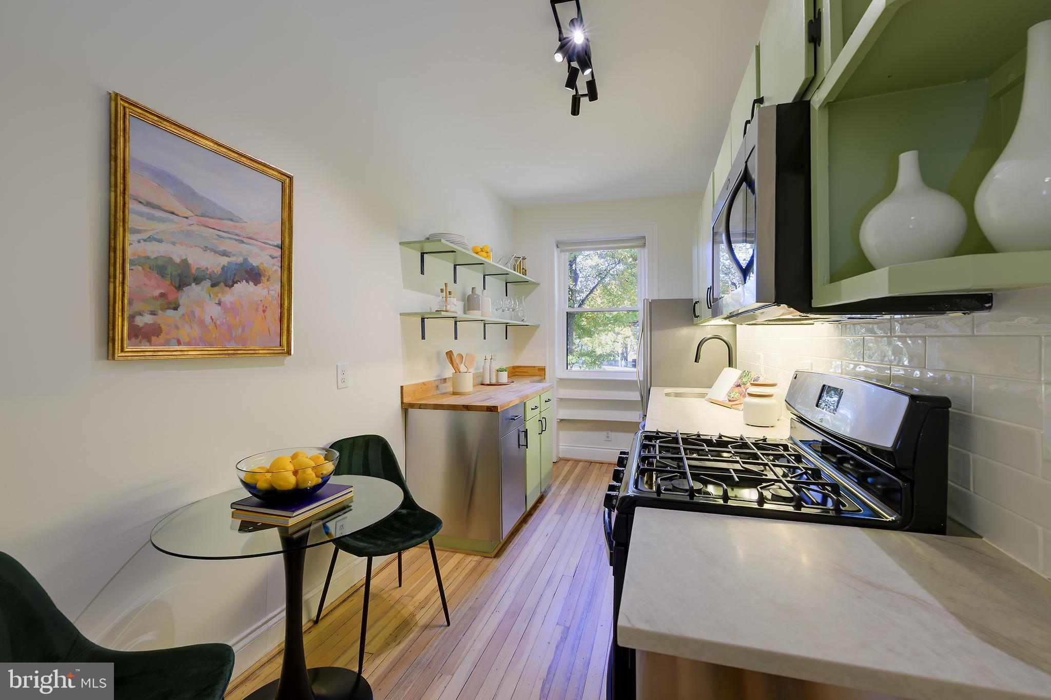 3100 Connecticut Avenue Northwest, Unit 145 Washington, DC 20008 - Photo 13 of 35 a living room with furniture and a fireplace