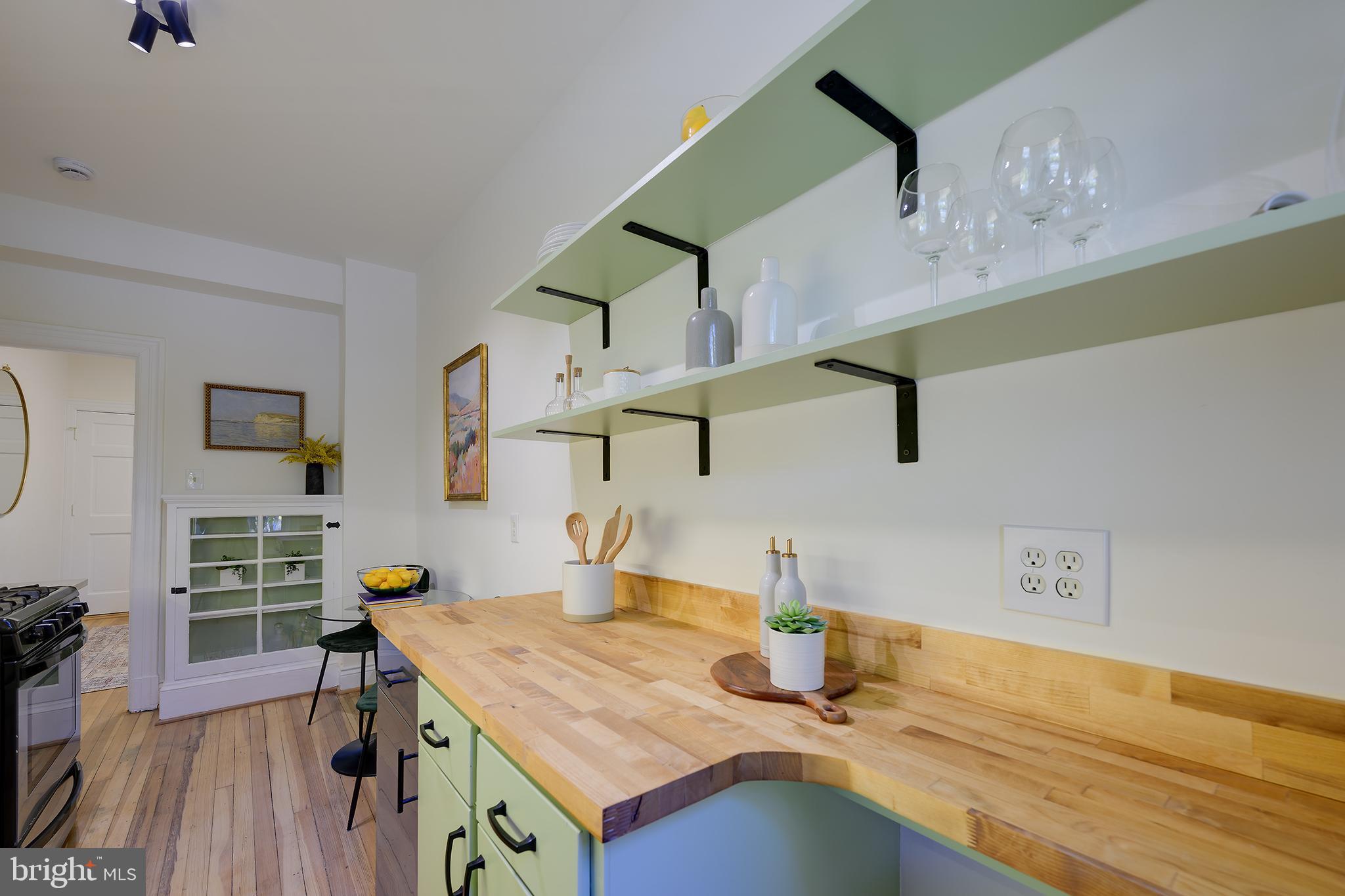 3100 Connecticut Avenue Northwest, Unit 145 Washington, DC 20008 - Photo 18 of 35 a kitchen with a sink cabinets and wooden floor