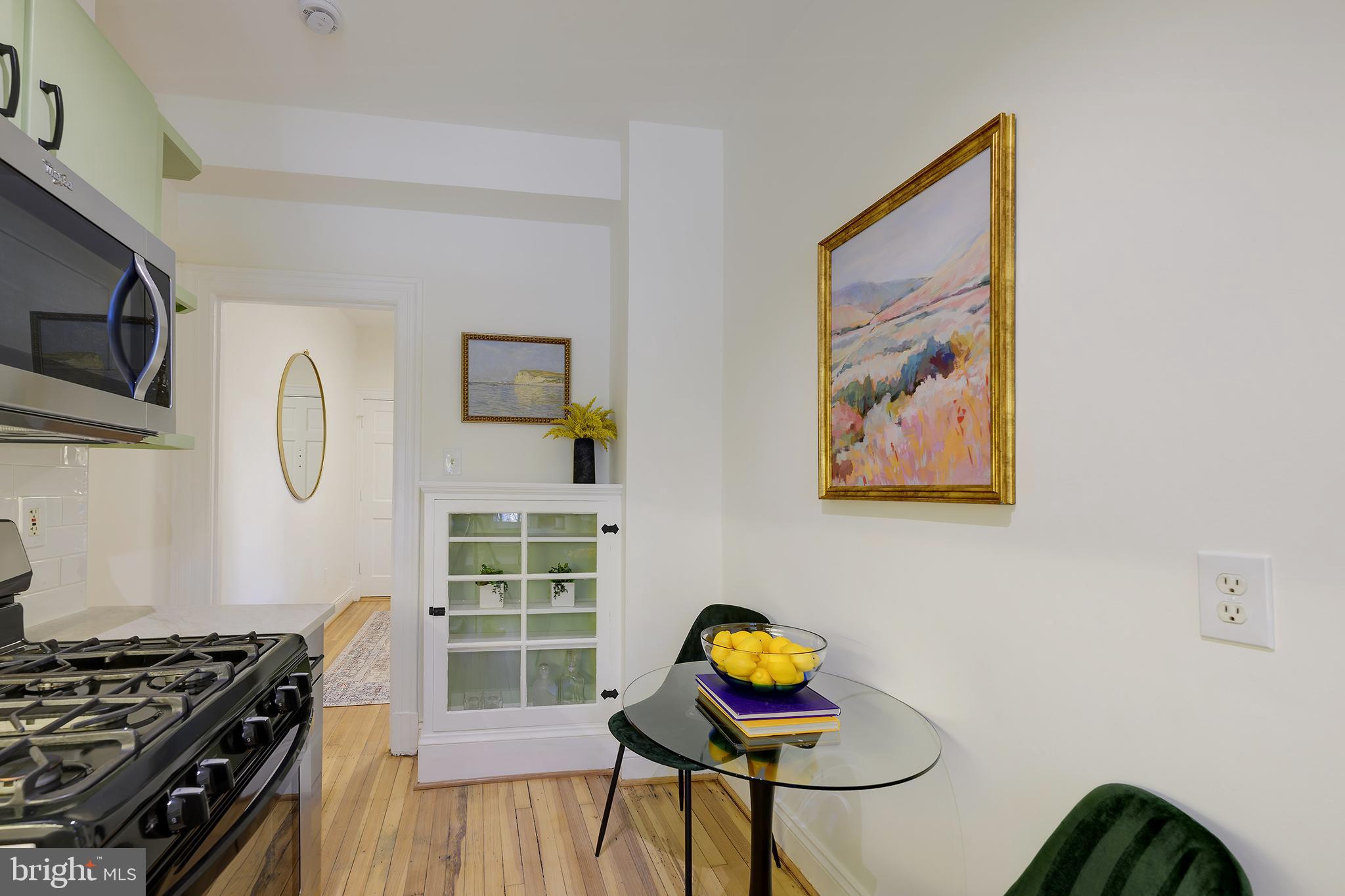 3100 Connecticut Avenue Northwest, Unit 145 Washington, DC 20008 - Photo 19 of 35 a view of a dining room with furniture and wooden floor