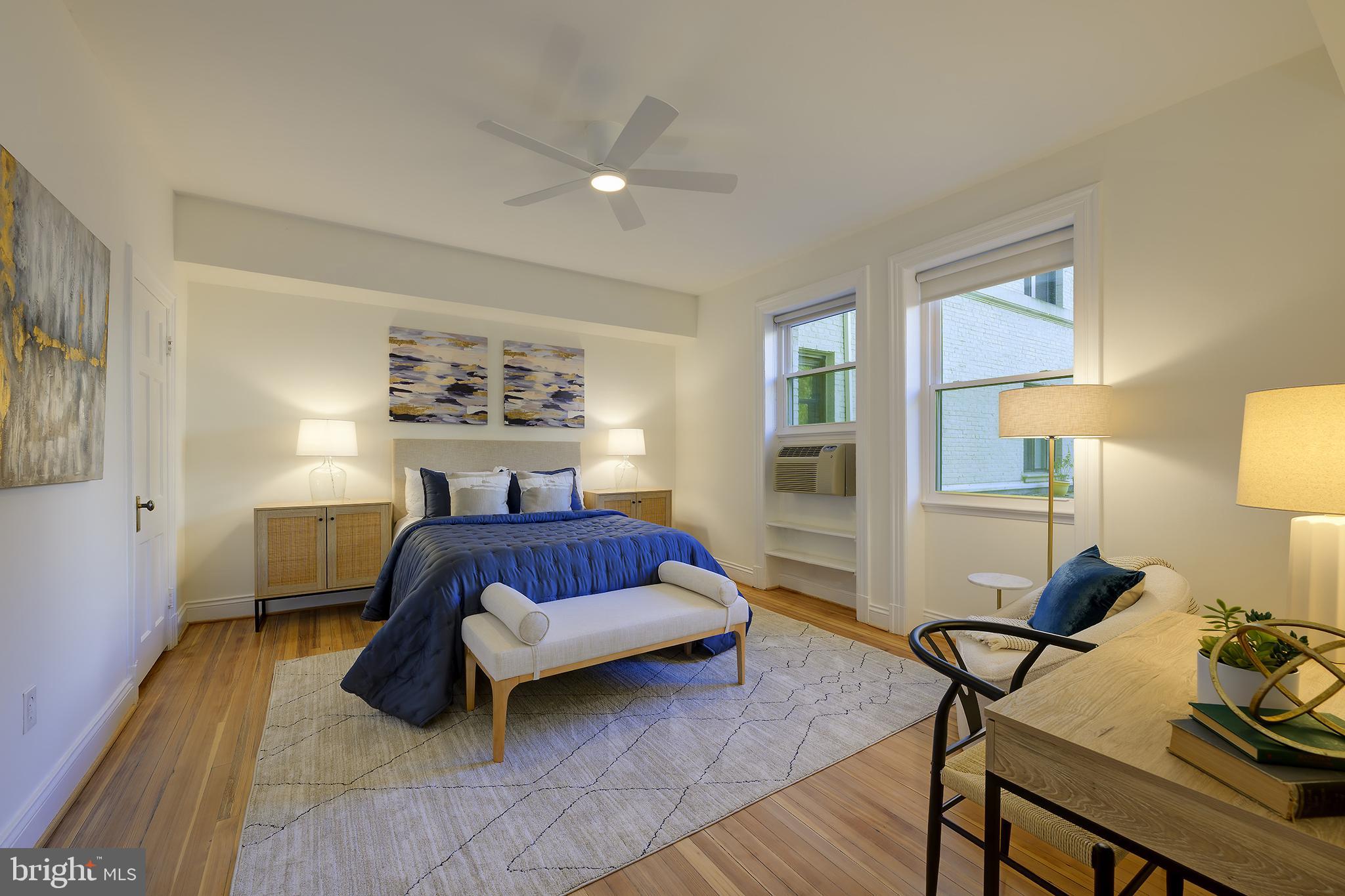 3100 Connecticut Avenue Northwest, Unit 145 Washington, DC 20008 - Photo 20 of 35 a bedroom with a bed and a table in it