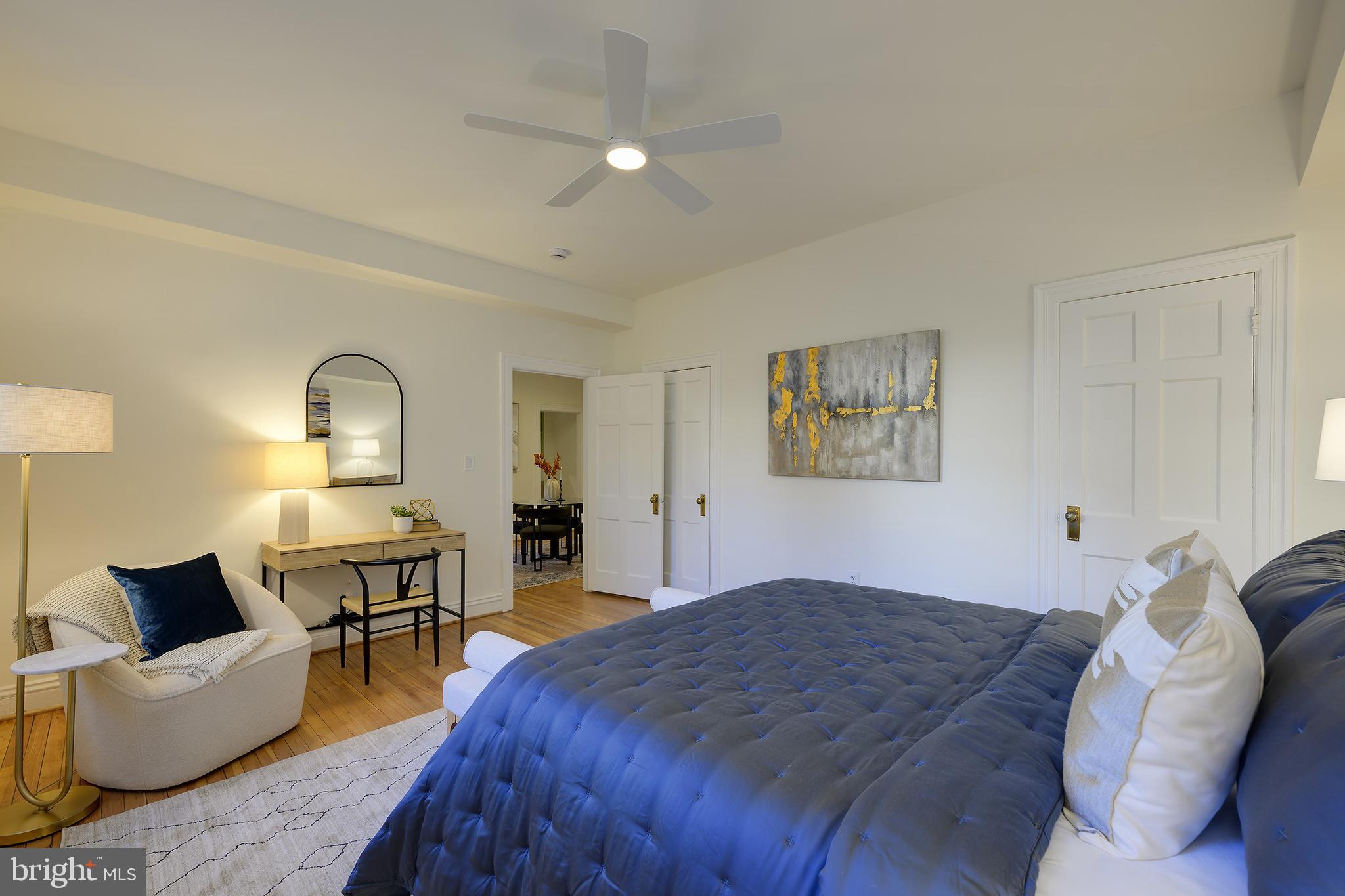 3100 Connecticut Avenue Northwest, Unit 145 Washington, DC 20008 - Photo 23 of 35 a bedroom with a bed and wooden floor