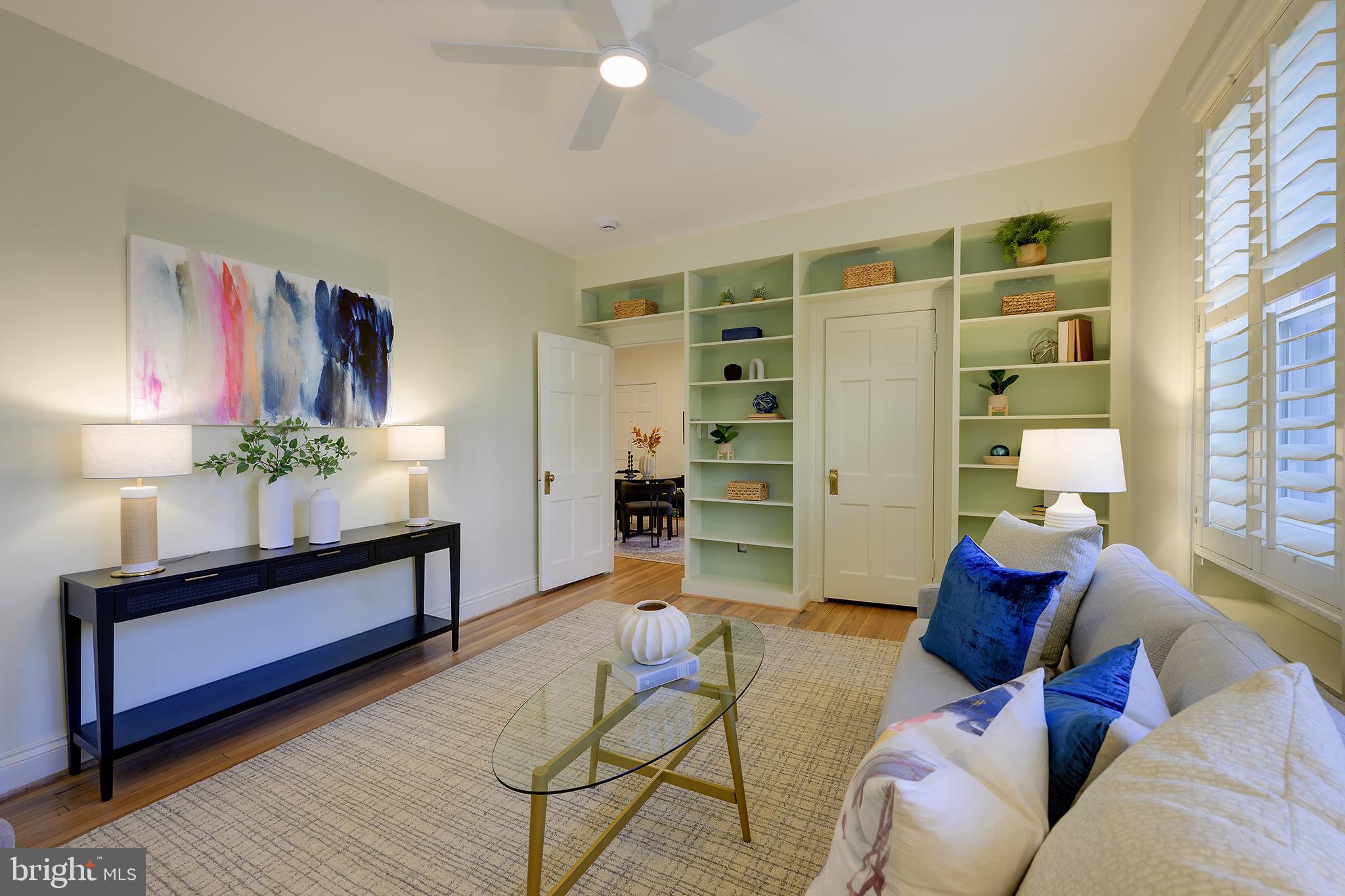 3100 Connecticut Avenue Northwest, Unit 145 Washington, DC 20008 - Photo 7 of 35 a living room with furniture and a potted plant