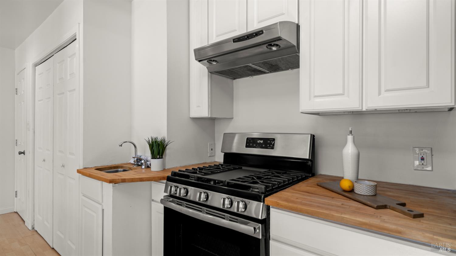 38 Bret Avenue San Rafael, CA 94901 - Photo 15 of 52 a stove top oven sitting inside of a kitchen