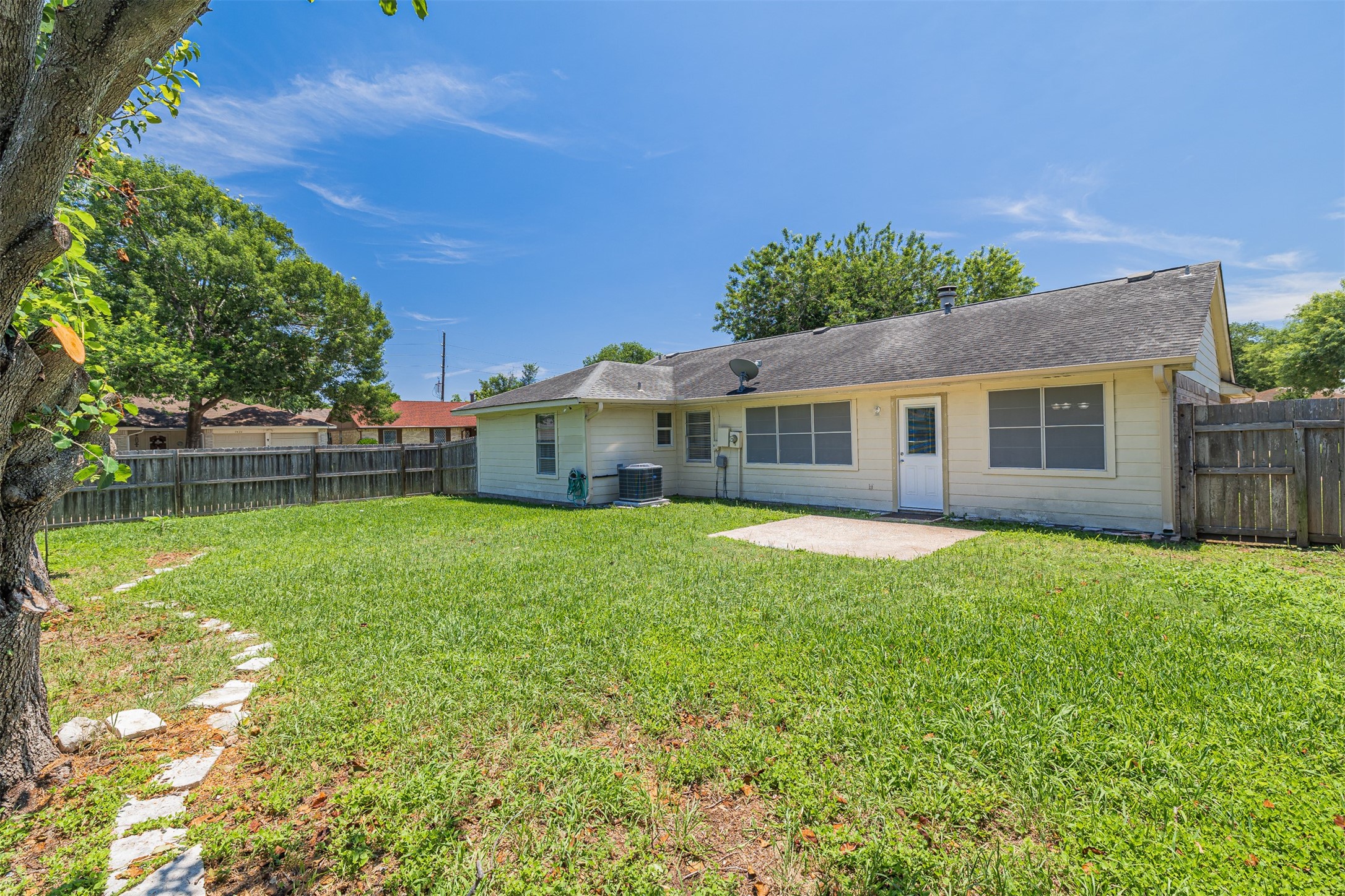 16702 Pebbleglen Drive Houston, TX 77095 - Photo 16 of 17 a front view of a house with a garden