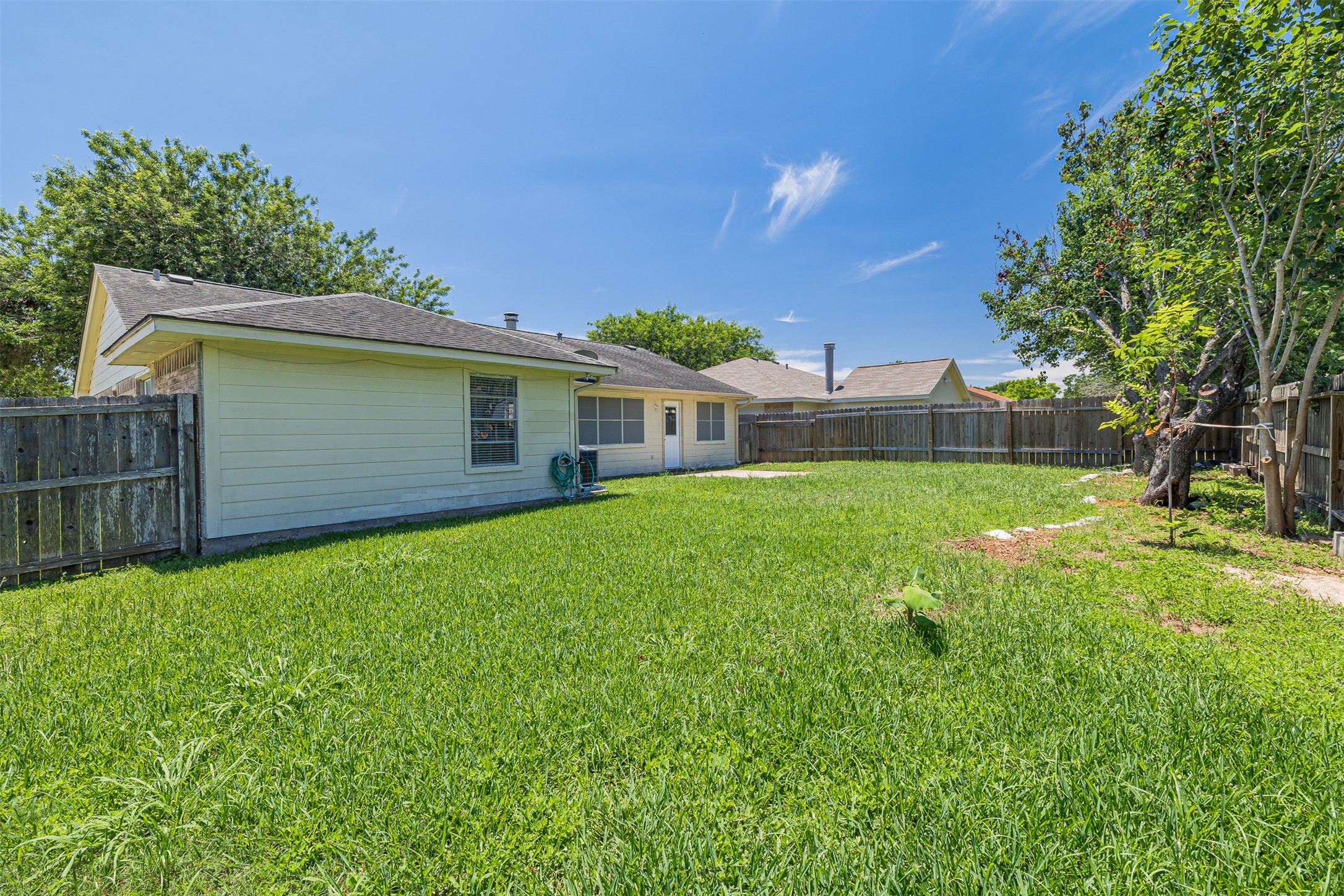 16702 Pebbleglen Drive Houston, TX 77095 - Photo 17 of 17 a view of a house with a backyard