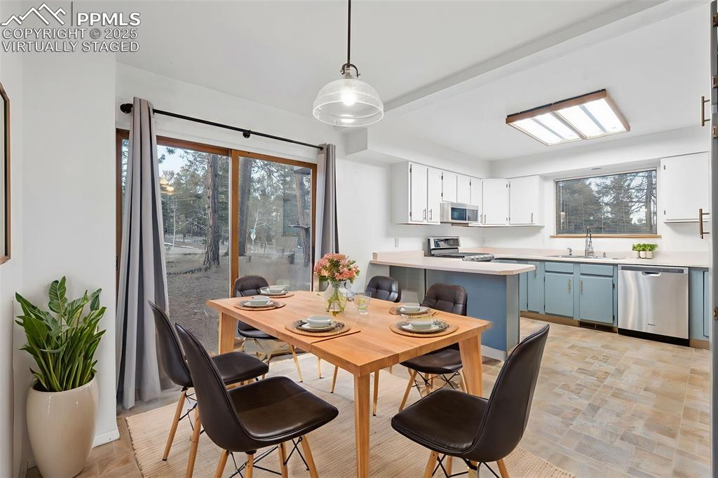 832 Spring Valley Drive Divide, CO 80814 - Photo 2 of 50 a kitchen with a table and chairs in it