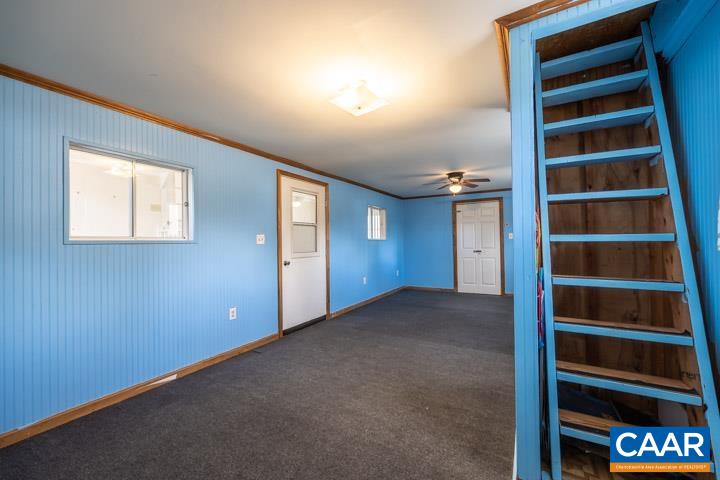 4657 Middle River Road Stanardsville, VA 22973 - Photo 32 of 40 a view of an empty room with empty shelves