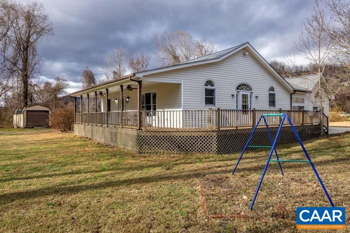 4657 Middle River Road Stanardsville, VA 22973 - Photo 4 of 40 a front view of a house with a yard