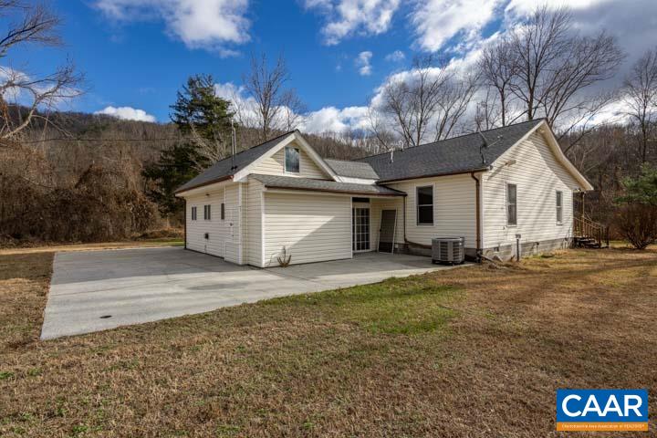 4657 Middle River Road Stanardsville, VA 22973 - Photo 6 of 40 a front view of a house with a yard and garage
