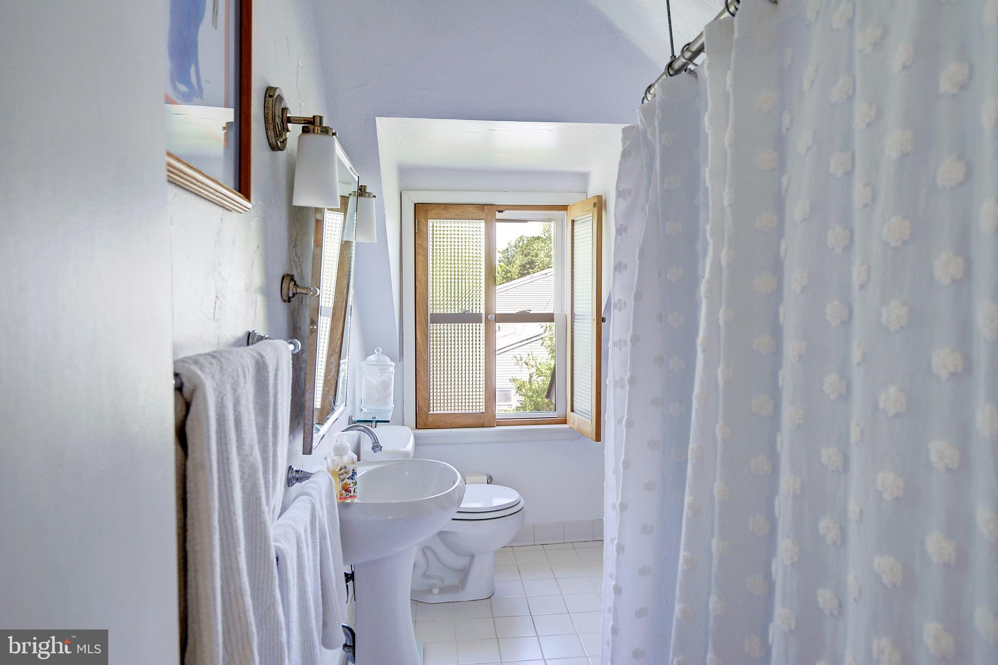 105 Franklin Road Glassboro, NJ 08028 - Photo 24 of 37 a bathroom with a granite countertop shower a toilet and a sink