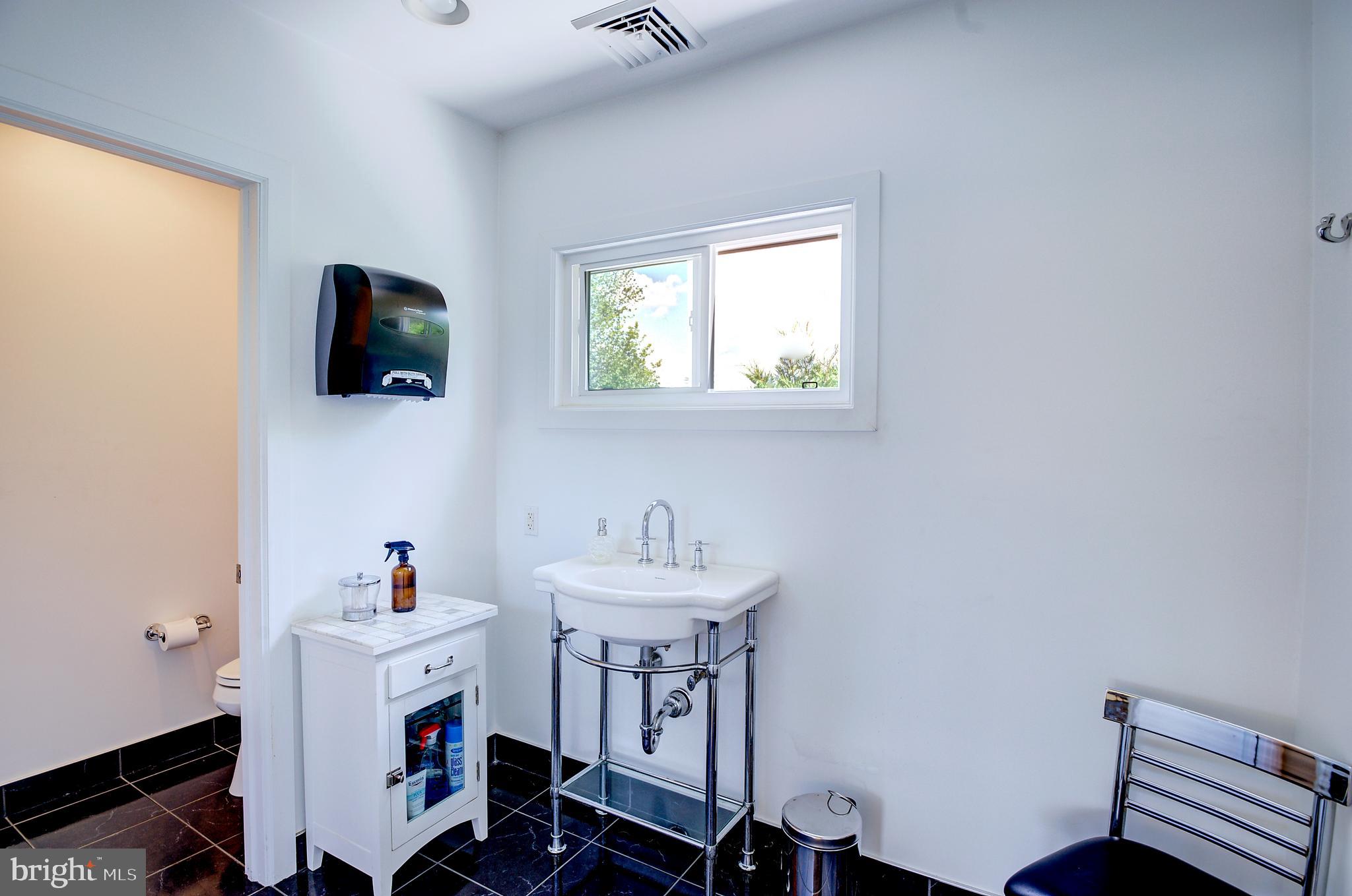 105 Franklin Road Glassboro, NJ 08028 - Photo 30 of 37 a bathroom with a sink and a window