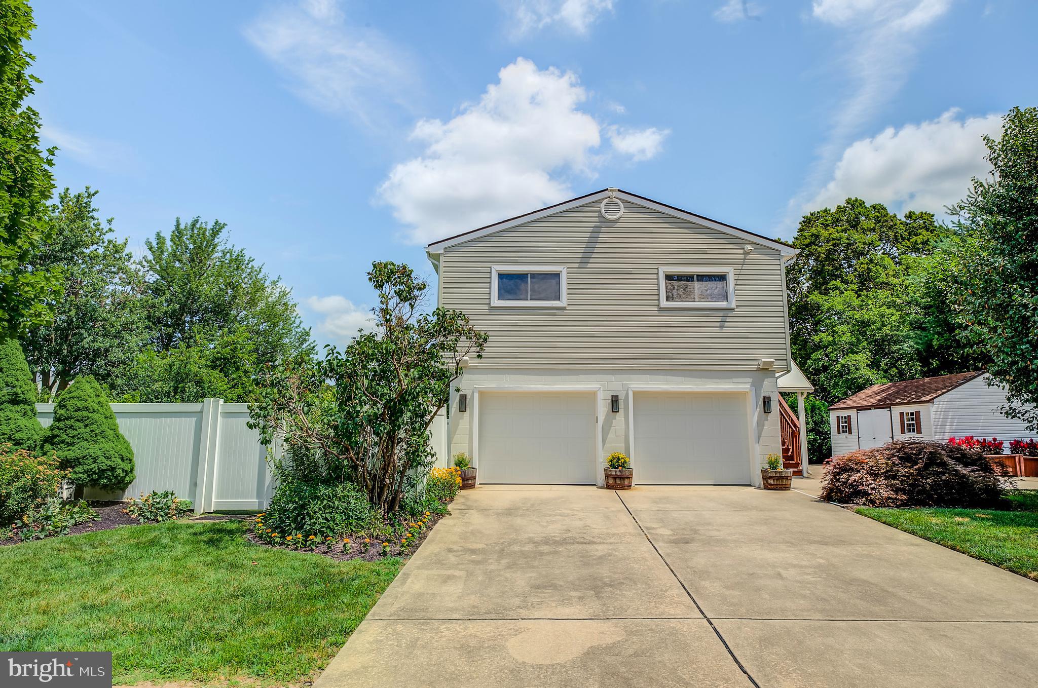 105 Franklin Road Glassboro, NJ 08028 - Photo 36 of 37 a front view of a house with a yard and garage