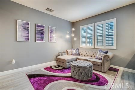 865 Orchid Way, Unit B Azusa, CA 91702 - Photo 5 of 12 a living room with furniture chess board and a window
