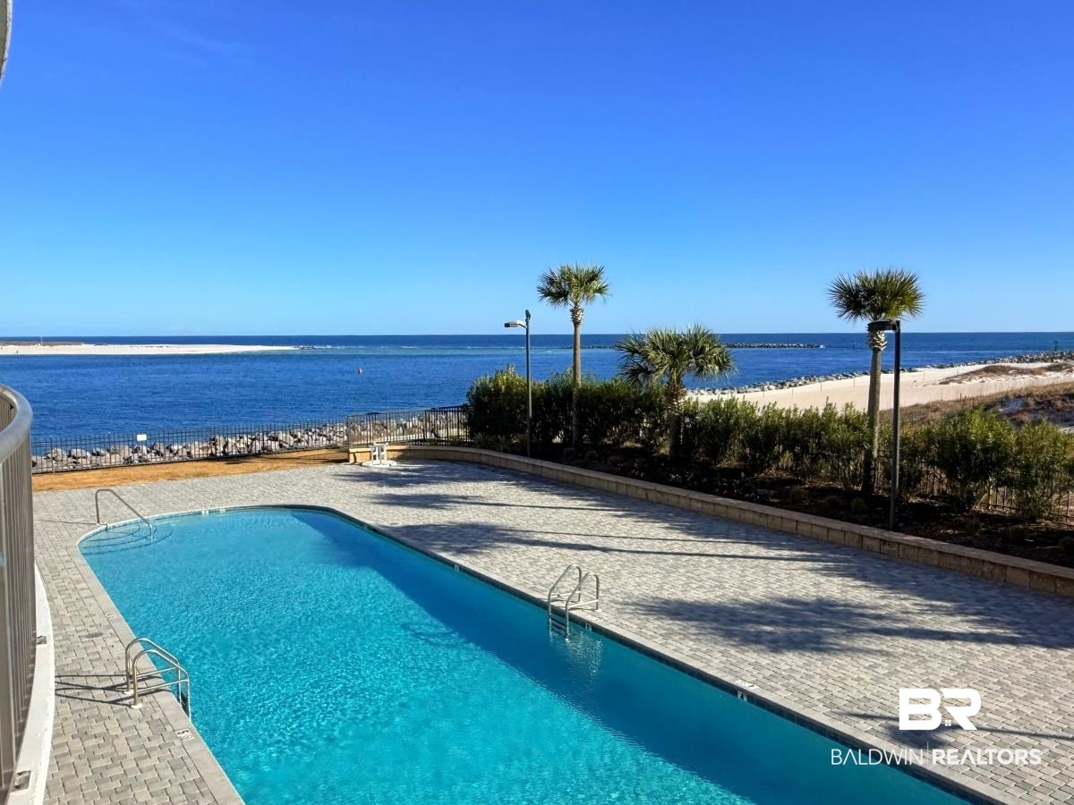 27284 Gulf Road, Unit 212 Orange Beach, AL 36561 - Photo 28 of 35 Community pool featuring view of water and beach