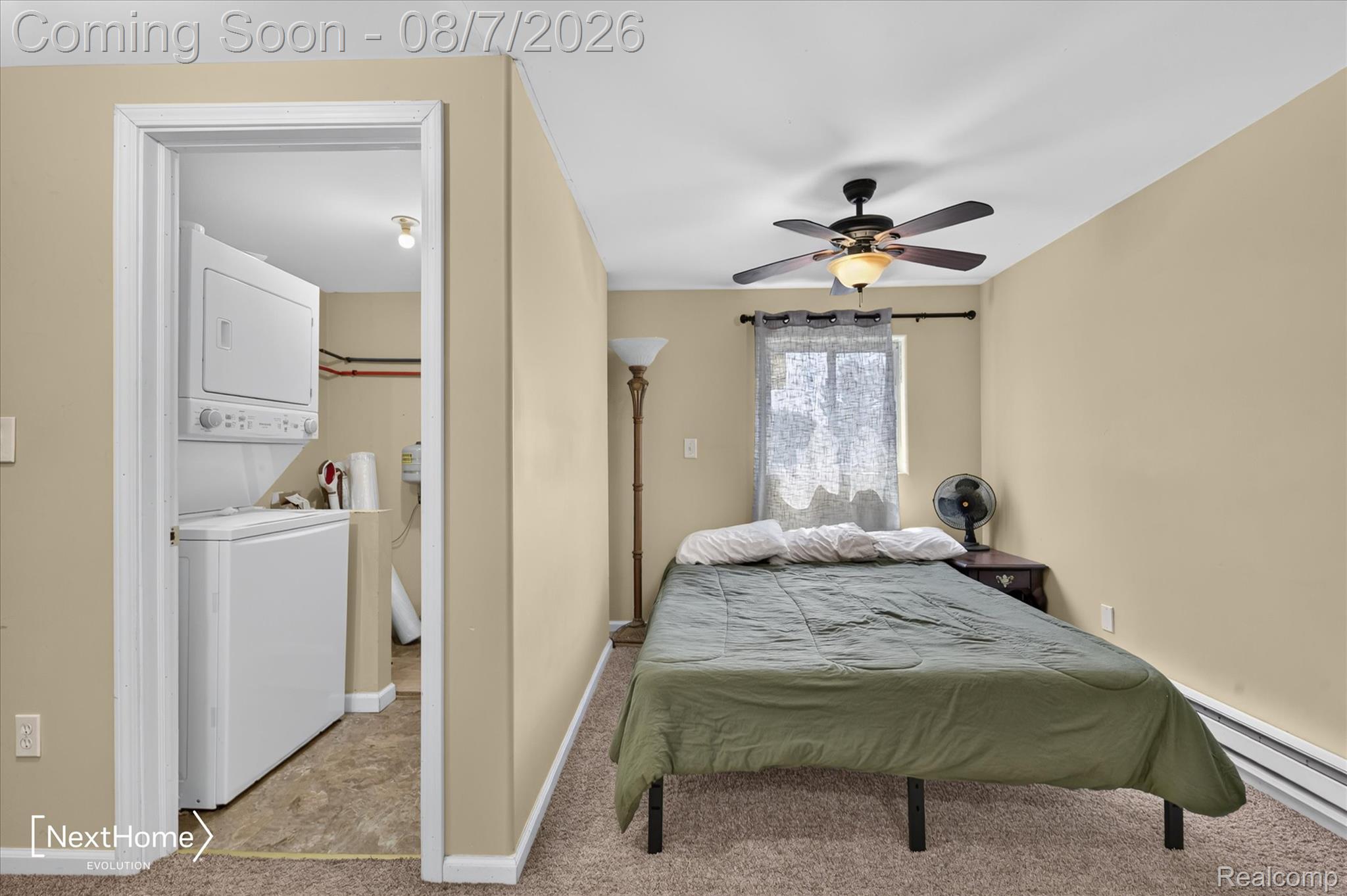 23740 Carleton West Road Belleville, MI 48111 - Photo 41 of 58 Room featuring a ceiling fan with integrated lighting, a window with curtains, and carpeting